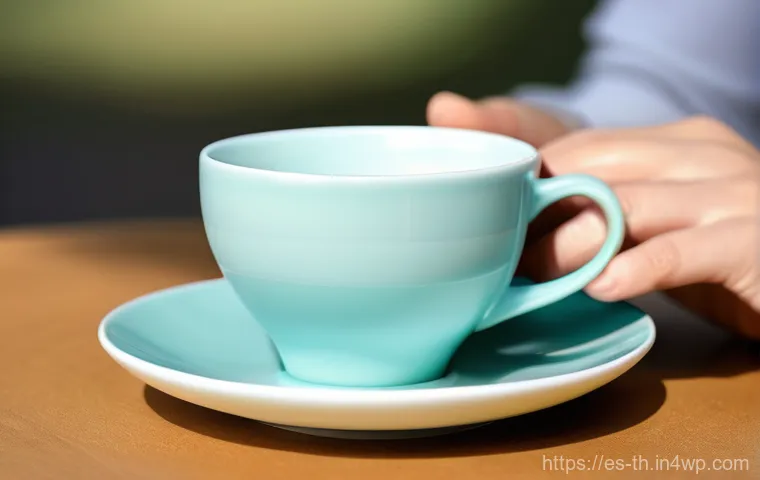 물성매력 디자인에서의 심리적 요소 - **Aesthetic Comfort: The Ergonomic Teacup**
    A close-up, high-definition photograph of a person's...